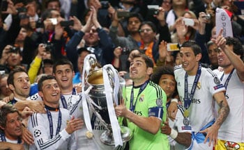 Winners holding trophy and wearing medals at UEFA Champions Festival