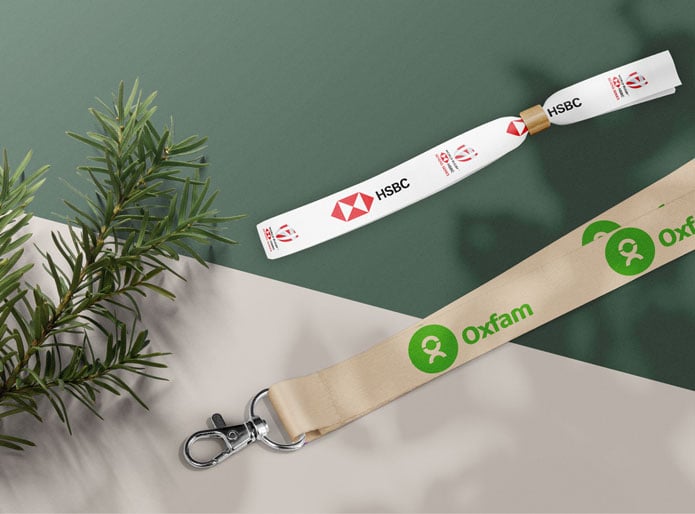 a scene with a green and beige background featuring eco friendly wristband & lanyard 