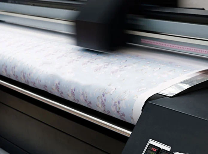 a digital printer, printing a cloth material so fast that its blurry 