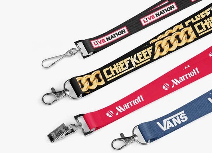 a big stack of lanyards showing a wide range of custom designs, sizes, attachments and print methods