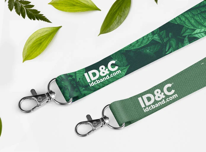 our custom eco friendly pet and bamboo lanyards on a white background with some leaves 