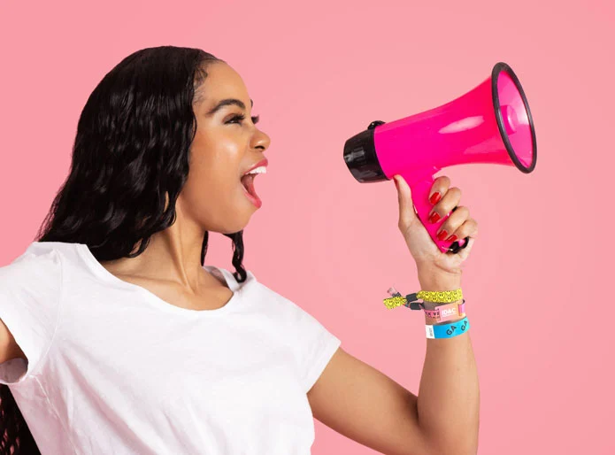 lady with a megaphone shouting why you should you shop with ID&C